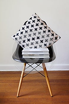 Contemporary black dining chair with modern crosses cushion