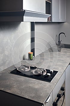 Contemporary black tempered glass gas stove hob with Two burners with auto ignition knob cast iron pan supports fan hood