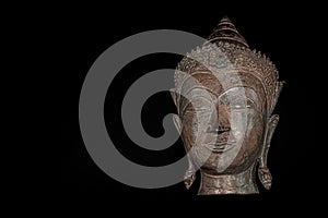 Contemporary Buddhism. The future of religion. High contrast image of metallic buddha head.