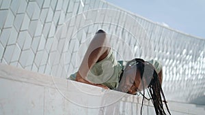 Contemporary choreographer practicing at abstract building. Active man dance