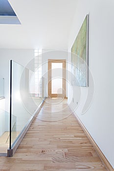 Contemporary corridor with glass banister