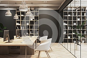 Contemporary coworking office interior with bookshelves and furniture.