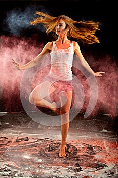 Contemporary dance girl spin pink blue powder