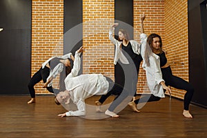 Contemporary dance group poses in studio