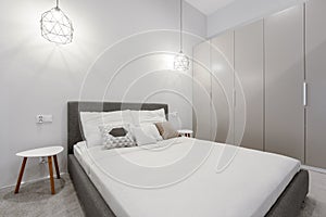 Contemporary designed bedroom with big wardrobe