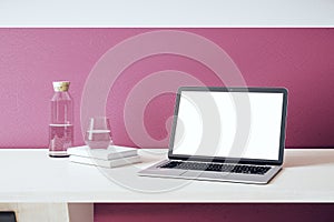 Contemporary designer desktop with white laptop screen