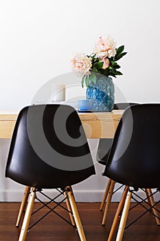 Contemporary dining table and retro chairs