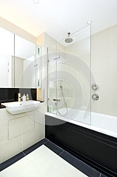 Contemporary ensuite bathroom with modern bath