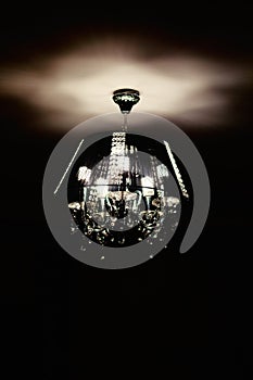 Contemporary glass chandelier isolated over black background