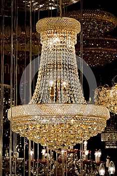 Contemporary glass chandelier over black background