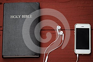 Contemporary image of a Bible and mobile phone