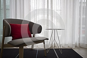Contemporary interior grey chair sheer curtains photo