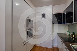 Contemporary interior of kitchen in luxury flat. Modern kitchen set.