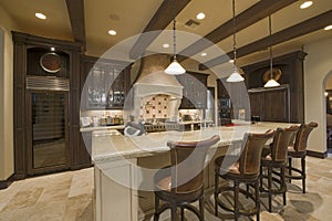 Contemporary kitchen counter with chair in luxury mansion