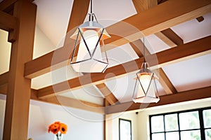 contemporary lighting fixtures against tudor wooden frames in annex