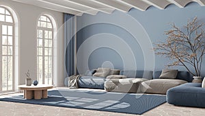 Contemporary living room in white and blue tones. Velvet sofa and carpet. Stone floor, arched windows and vaulted ceiling.