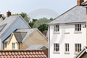 Contemporary living suburban housing estate homes. Modern English town houses.