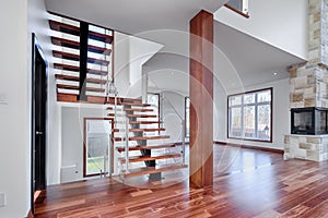 Contemporary Mahogany stairs new house with post photo