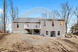 Contemporary and modern ranch-style house in the countryside with a gabled roofline and a porch