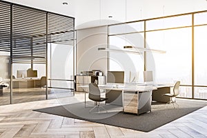 Contemporary office interior with equipment, furniture, sunlight, window with city view and wooden flooring. Worplace and