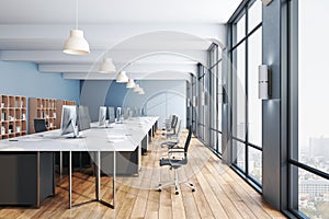 Contemporary  office interior room with computers and wooden floor