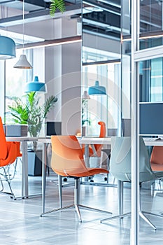 Modern Office Interior With Orange Chairs and Glass Partitions During Daytime photo