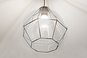 Contemporary pendant light made of metal. High-tech style interior concept