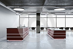 Contemporary reception table with computers on loft interior