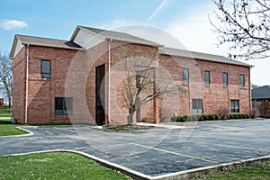 Contemporary Red Brick Building with Parking Lot