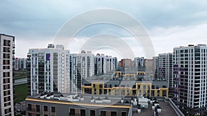 Contemporary residential buildings in the city. Stock footage. Exterior of a modern design of multistorey apartment