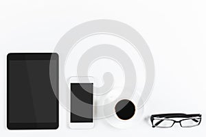 Contemporary tabletop with empty tablet and cellphone