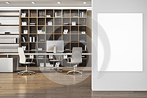 Contemporary wooden and concrete library office interior with blank mock up banner on wall, furniture and decorative plant. 3D