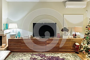 Contemporary wooden living room cabinet with flat tv.