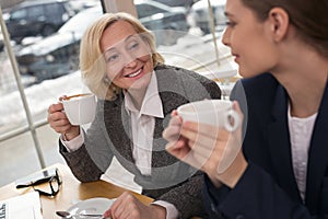 Content businesswomen drinking hot aroma coffee