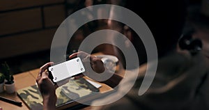 Content Creator content creator, is captured in the photo, holding a cellphone and laptop with white screens, signifying