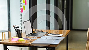 Content creator working desk with empty screen laptop, content idea on sticky notes