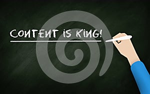 Content Is king Chalkboard. Human hand writing