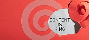 Content Is King message on torn paper