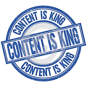 CONTENT IS KING written word on blue stamp sign