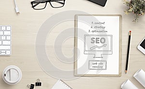 Content strategy for SEO optimization sketch on office desk with copy space beside