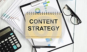 Content strategy word cloud on a paper tablet