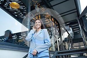 Content woman smiling outdoors looking upwards