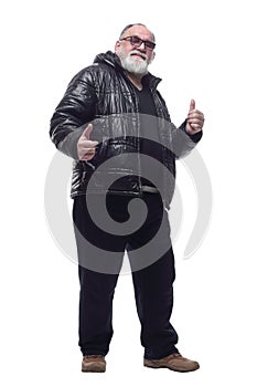 contented bearded man in a winter jacket giving a thumbs up.