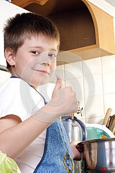 Contented boy at kitchen