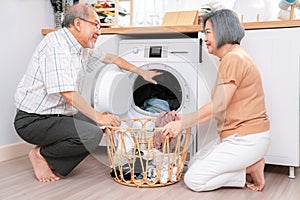 Contented senior couple doing laundry together.