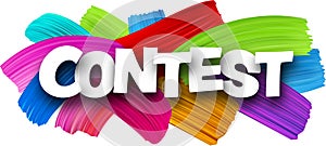 Contest paper word sign with colorful spectrum paint brush strokes over white