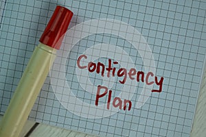 Contigency Plan write on a book isolated on Wooden Table