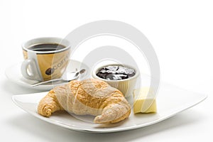 Continental breakfast of coffee and croissants