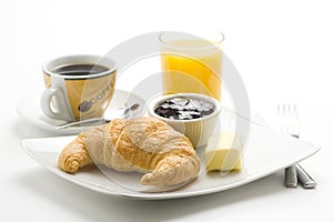 Continental breakfast of coffee and croissants