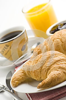 Continental breakfast of coffee and croissants